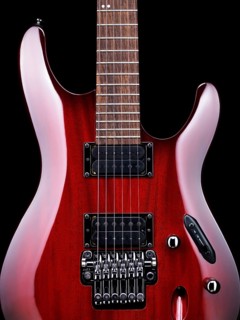 Red electric guitar Ibanez S-series S420 closeup detail on black background