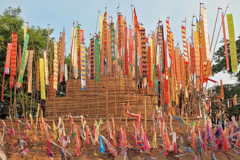 The flags and pennants adorn a special bamboo tower. Thai New Year - Songkran