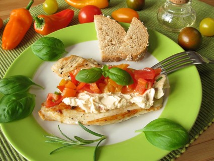 Cream cheese and tomato and pepper salsa on turkey escalope