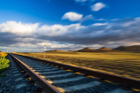 Single railway track at sunset, Central Bohemian Uplands, Czech Republic. Railway track in nature