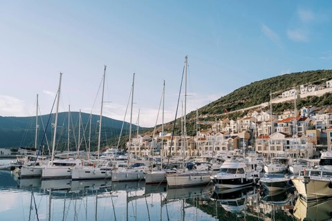 Lustica bay marina with moored sailing yachts and colorful villas. Montenegro.