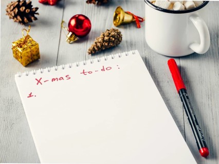 Christmas gifts shopping planning. Make shopping or to-do list for Christmas. Notebook, mug hot