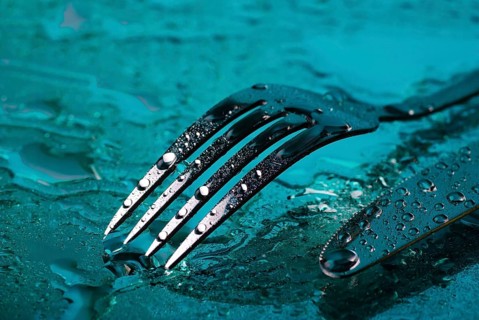 Fork and knife under the blue water