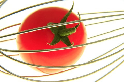 Cocktail tomato in a whisk