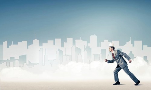 King businessman in elegant suit running and blue cityscape silhouette at background