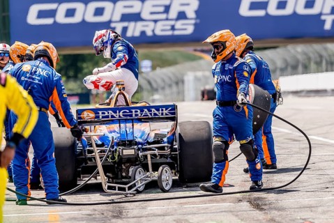 SCOTT DIXON (9) of Auckland, New Zealand comes down pit road after exiting early from Honda Indy