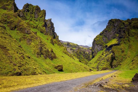 Canyon Pakgil - green grass and moss on fantastic rocks. On canyon there is dirt road. The summer