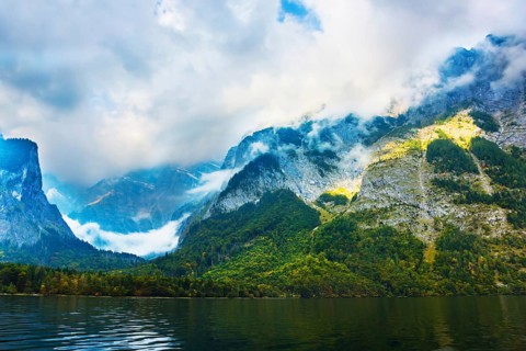 Koenigssee - the cleanest lake in Germany. The lake is surrounded by high mountains. Mountain Lake