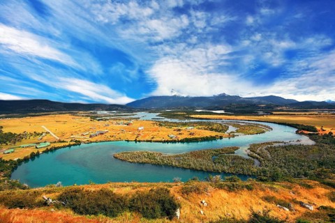 Glen Serrano. Meandering river bed of yellow autumn coast
