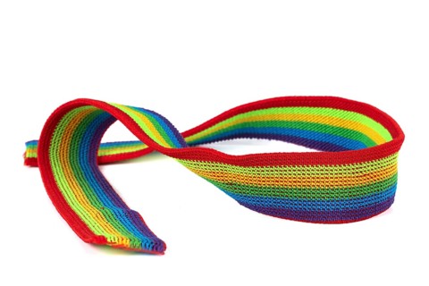 Colourful rainbow ribbon closeup isolated on white background. Colourful LGBT design. Curly,