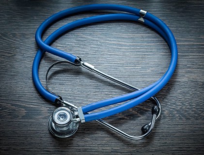 Stethoscope on vintage wooden board horizontal image