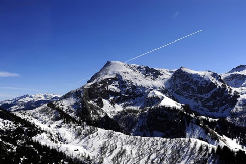 Stripes of condensation in the blue sky, on Jenner Mountain, Schönau am Königssee, Berchtesgaden