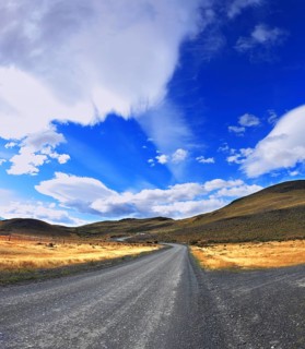 Picture taken with a fisheye lens. The dirt road in the Chile National Park Torres del Paine. Magic