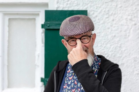 An image of an old man with a beard outdoor