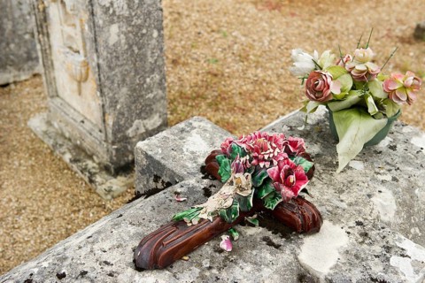 Very old stone graves with moss at the cemetery