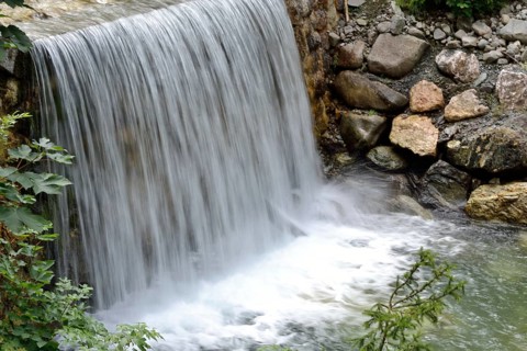 Small stream with wide waterfall