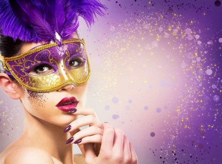 Beautiful woman with dramatic mekaup and pruple lipstick wearing puprle mask. Light background.