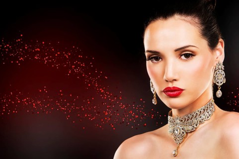 Beautiful woman with dark makeup and red lipstick posing on black background, Toronto, Canada,