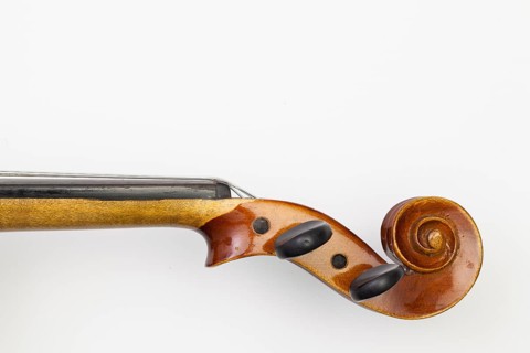 Top view close up shot of old violin on the white table. Flat Lay Image