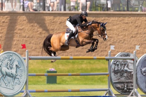 Vaclav Stanek from Czechoslovakia, and riding Quintin, compete in the 1.60m Grand Prix during The