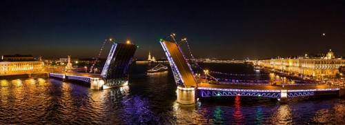 Aerial panorama of the drawn Palace bridge, Winter Palace, Peter and Paul Fortress and Rostral
