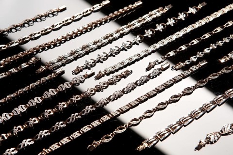 Golden bracelets on a studio background