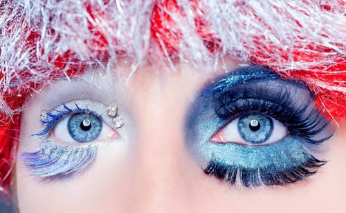 Asymmetrical christmas concept eye makeup winter red silver macro closeup