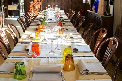 Table in an Italian restaurant. Wooden antique furniture