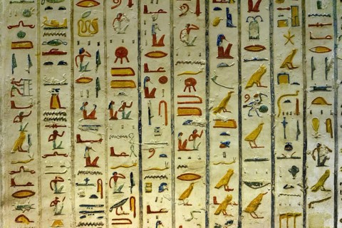 Ancient color egypt images and hieroglyphics on wall