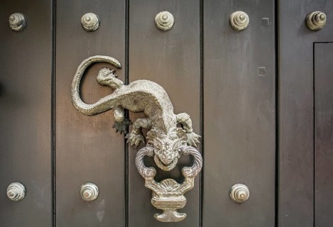 Close-up of traditional door knocker on wooden door in Cartagena, Colombia, South America