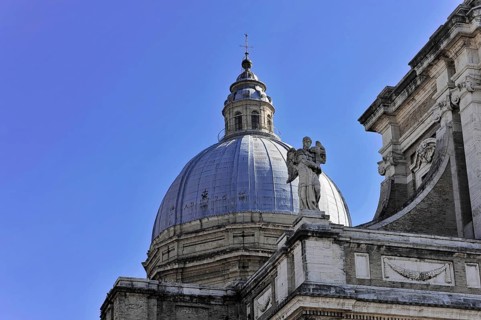 Basilica Santa Maria degli Angeli, Assisi, Umbria, Italy, Detail of an imposing dome with a statue