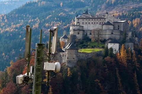 A mobile phone transmitter and Werfenweng Castle, Salzburger Land, Austria Austria
