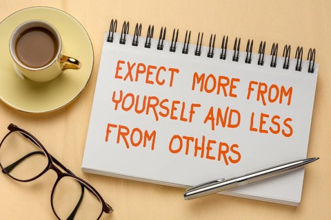 Expect more from yourself and less from others - inspirational handwriting in a sketchbook, a flat