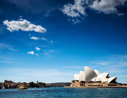 Famous sydney landmark opera house view with ferry boat in australia on sunny day