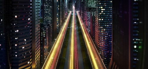 Spectacular modern city at night with light trails. 3d rendering imaginary concept city