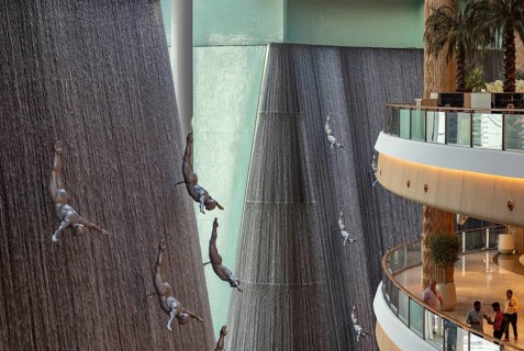 A picture of the Dubai Mall waterfalls and sculptures that decorate one of the many atriums of the