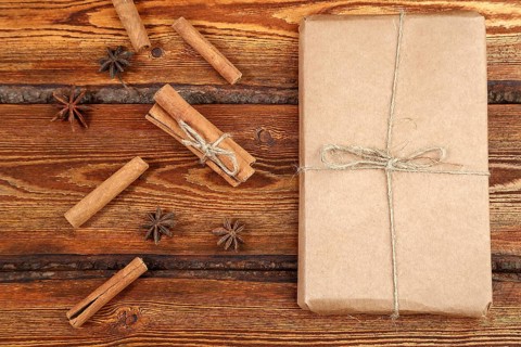 Gift Packed in eco-friendly biodegradable cardboard on dark old wooden background with blank space