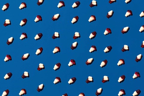 Flat lay photo tasty concept, minimal Sweet Candy jelly bean Colorful pattern on blue pastel