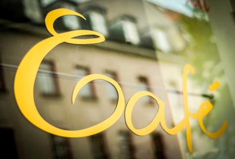 Sign In The Window Of A Urban Cafe