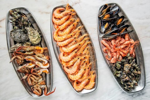 Mixed fresh portuguese seafood selection gourmet set platter meal on table