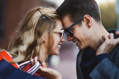 Picture showing young couple shopping in the city. Portrait of a couple with shopping bags in the