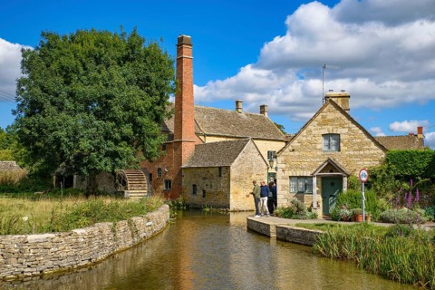 Old water mill in Lower Slaughter, a village in Cotswolds area, England, UK