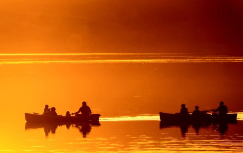Sunset Sillouette Canoe orange color Saskatchewan Canada
