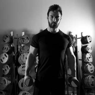 Dumbbell man workout fitness club at weightlifting gym