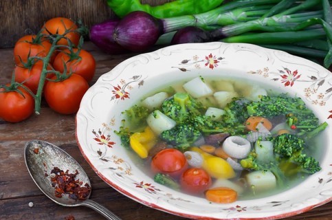 Big bowl of vegetable soup seasoned with hot spices