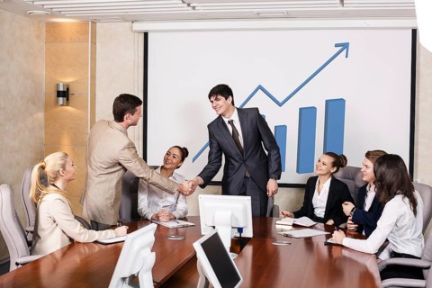 Business people shaking hands, finishing up a meeting