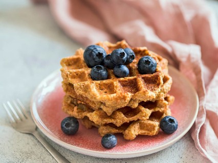 Easy healthy gluten free oat waffles with copy space. Stack of appetizing homemade waffles with oat