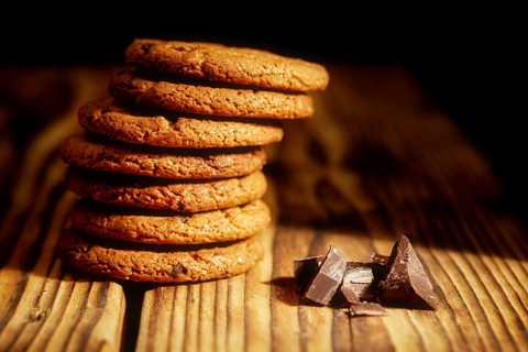 Chocolate chip cookies and cookies with oat flakes or oatmeal on the old wooden table