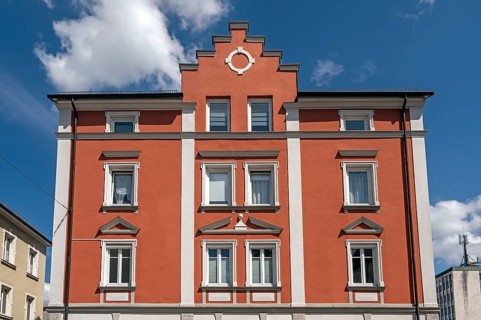 Red classicist façade with stepped gable, Kempten, Allgäu, Swabia, Bavaria, Germany, Europe