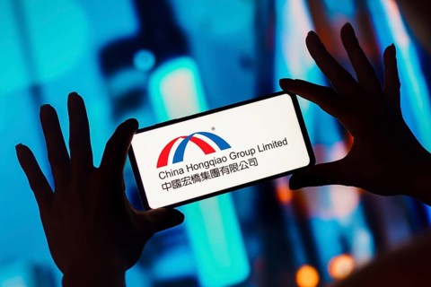 In this photo illustration, the China Hongqiao Group Limited logo is displayed on a smartphone